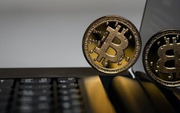 Bitcoin coin on a laptop.